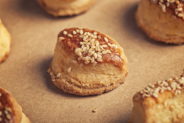 Fresh homemade salty scones with cheese and sesame