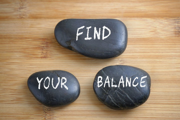 Fototapeta na wymiar Find your balance, three words motivational slogan conceptual