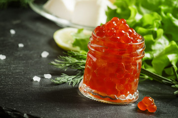 Red caviar with lettuce, dill, rosemary, lemon, sea salt and but