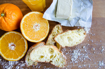 Fresh oranges, juice and pastry 3
Cut raw oranges, juice and white bread on the wooden board