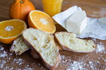 Fresh oranges, juice and pastry 2
Cut raw oranges, juice and white bread on the wooden board