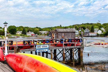 New England seaside kayak rentals summer scene - 101225383