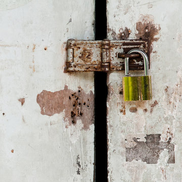 old lock on white door