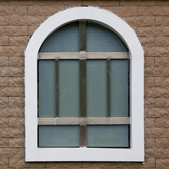 Arched window in a stone wall