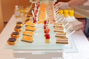Different types of canapes on buffet table