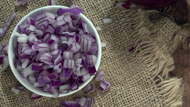 Portion of rotating diced Red Onions (seamless loopable, 4K UHD)