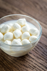 Bowl of Bocconcini mozzarella on the wooden table