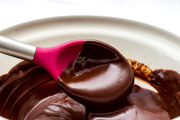 chocolate mix in a pink spoon 