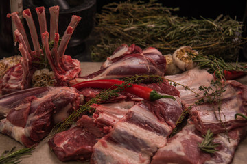 Fresh pork ribs, sirloin, meat and a bunch of rosemary