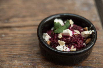 Appetizers in small bowls are on the table, and next is the bread or pita bread