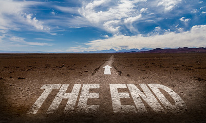 The End written on desert road