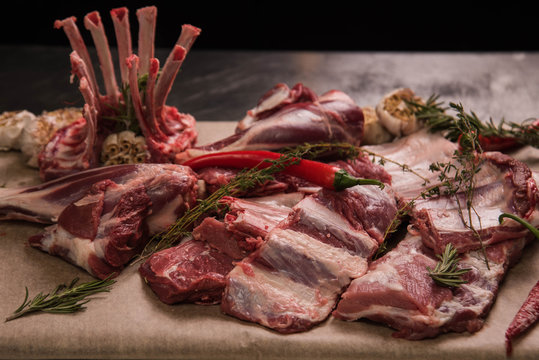 Fresh pork ribs, sirloin, meat and a bunch of rosemary