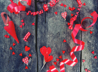 hearts and ribbons on wooden surface