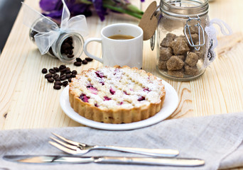Homemade pie with coffee on a wooden background