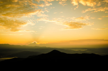art tone,blurry,silhouette of sunset in the mountain