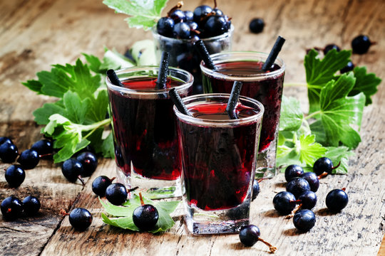 Cold vodka with blackcurrant juice and fresh berries, selective
