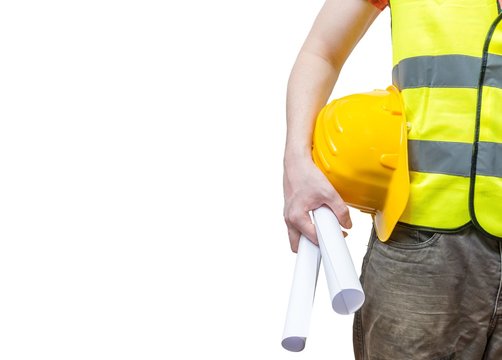 Worker (engineer) in yellow reflective vest holds papers. Isolated on white background.