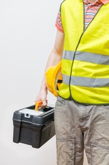 Worker with toolbox and yellow helmet. Maintenance concept.