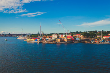 Fototapeta na wymiar Beautiful super wide-angle panoramic aerial view of Stockholm, Sweden with harbor and skyline with scenery beyond the city, seen from the observation tower, sunny summer day with blue sky 