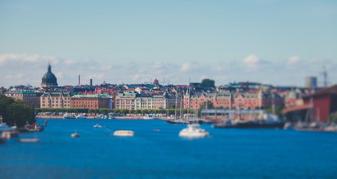 Beautiful super wide-angle panoramic aerial view of Stockholm, Sweden with harbor and skyline with scenery beyond the city, seen from the observation tower, sunny summer day with blue sky
