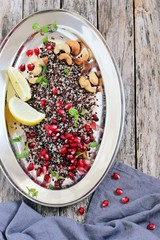 Quinoa salad with pomegranate and roasted nuts .Healthy eating. Superfoods concept