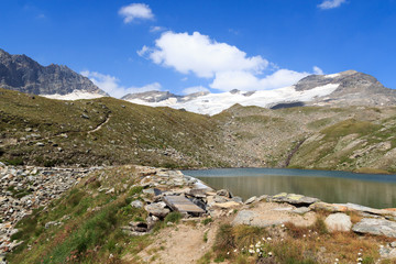 Fototapeta na wymiar Footpath, lake and glacier panorama with mountain Kristallwand in Hohe Tauern Alps, Austria