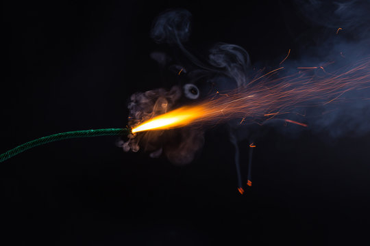 Fuse Burning With Sparkles And Smoke On Black Background. Dynamite  Firecracker Green Fuse. Stock Photo, Picture and Royalty Free Image. Image  119485661.