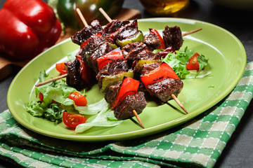 Grilled beef meat and vegetable kebabs