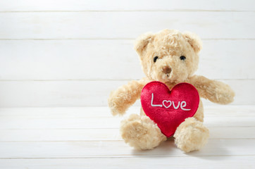 Brown Teddy Bear holding red heart
