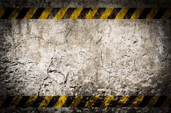 Hazard tape on blank dirty wall
