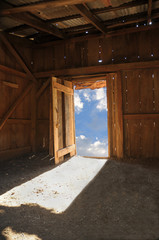 Wood shack with sky through door
