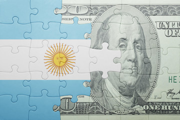 puzzle with the national flag of argentina and dollar banknote