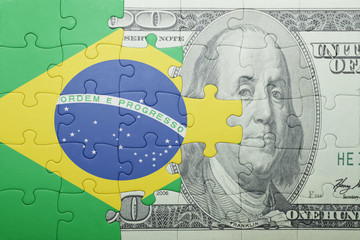 puzzle with the national flag of brazil and dollar banknote