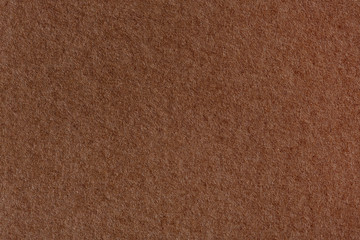 Dark brown pastel paper texture sample.