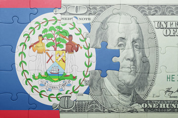 puzzle with the national flag of belize and dollar banknote