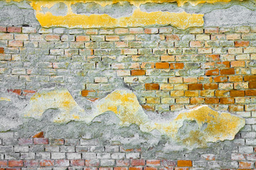Old colored damaged brick wall background