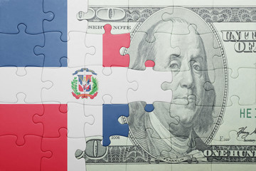 puzzle with the national flag of dominican republic and dollar banknote