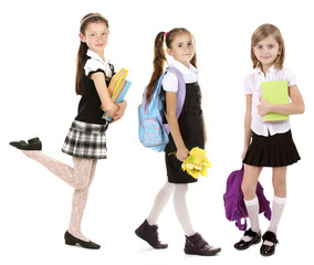 Fototapeta premium Cute happy schoolgirls, isolated on white