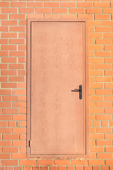 metal door in brick wall