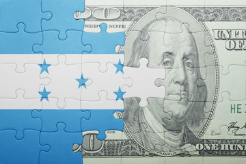 puzzle with the national flag of honduras and dollar banknote