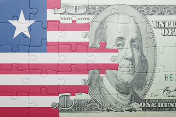 puzzle with the national flag of liberia and dollar banknote