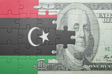 puzzle with the national flag of libya and dollar banknote