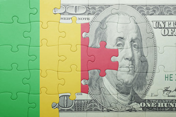 Fototapeta na wymiar puzzle with the national flag of mali and dollar banknote