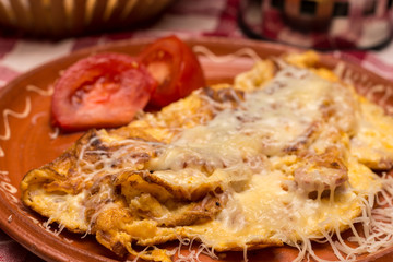 Omelet with cheese served and arranged