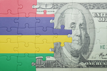 Fototapeta na wymiar puzzle with the national flag of mauritius and dollar banknote