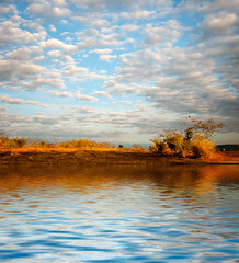 Surface Rippled of water with clouds and sky background