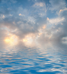Surface Rippled of water with clouds and sky background