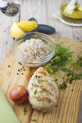 Grilled chicken breast with fresh vegetables .