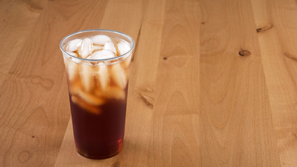 A large Fresh brewed Iced tea in a clear cup.