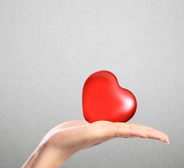 Obraz premium Red heart in hands